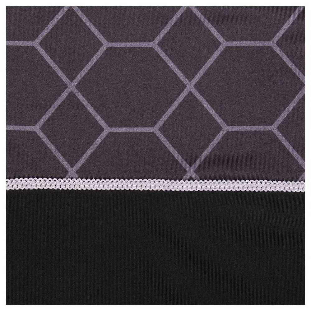 Close-up of fabric design on men's athletic sports top, featuring geometric pattern and breathable material.